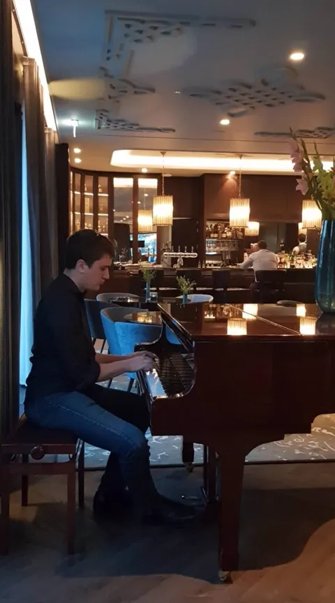 Patrick playing a grand piano